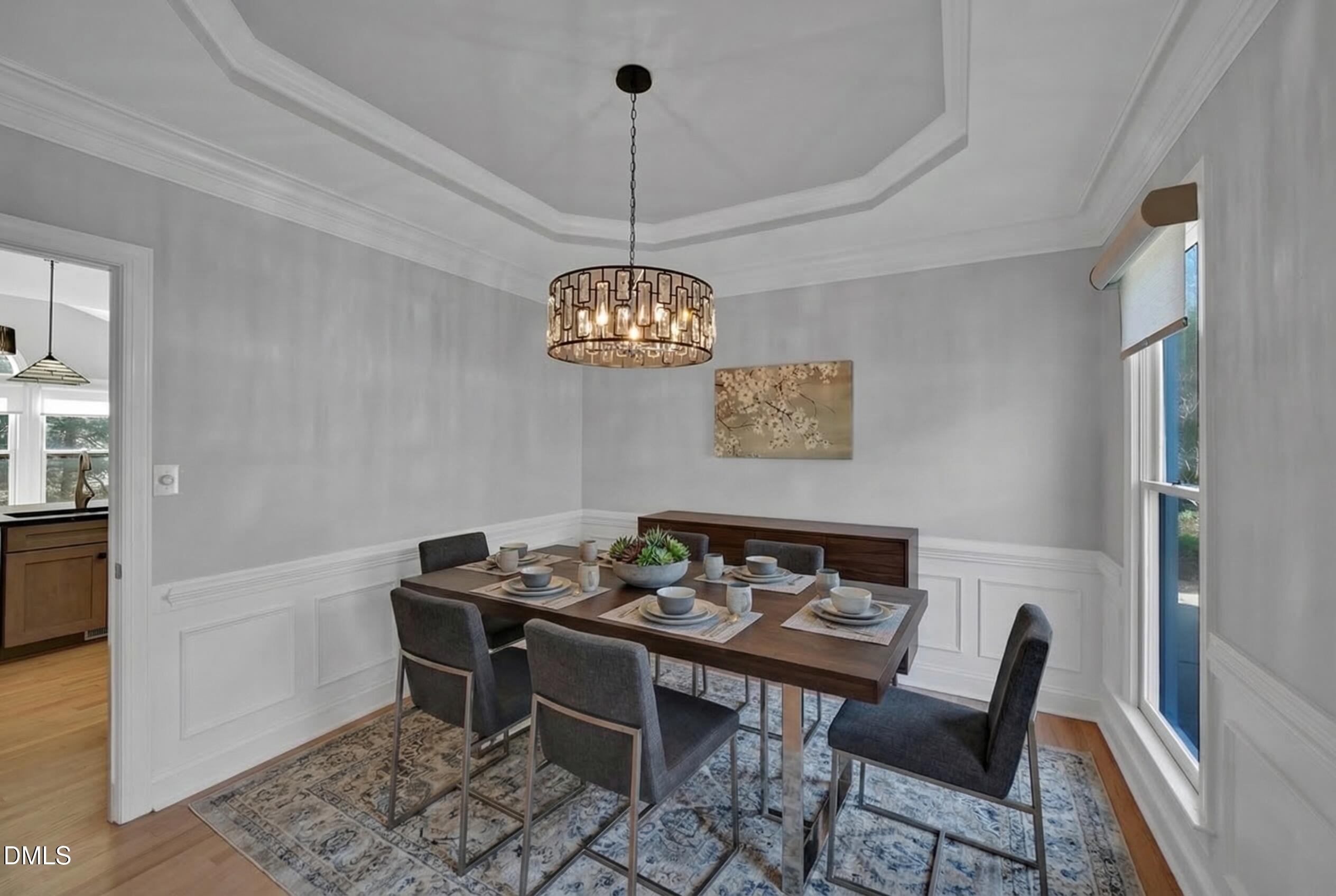 8005 Looking Glass Court Raleigh, NC 27612 - Photo 19 of 75 a view of a dining room furniture and chandelier