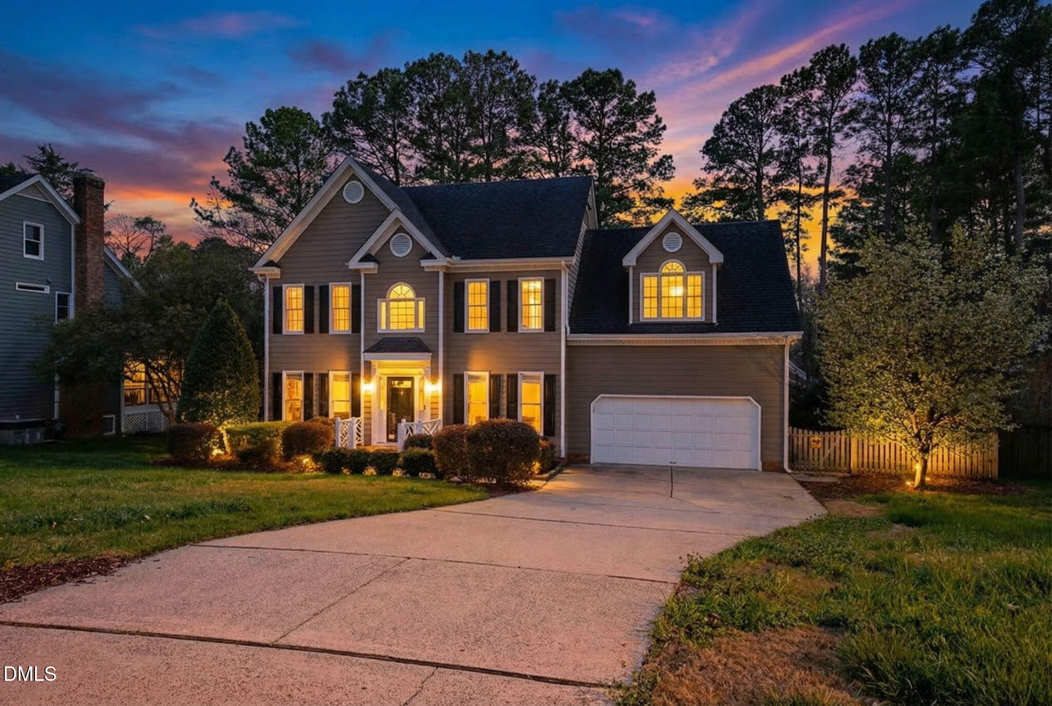 8005 Looking Glass Court Raleigh, NC 27612 - Photo 2 of 75 a front view of a house with a yard and garage
