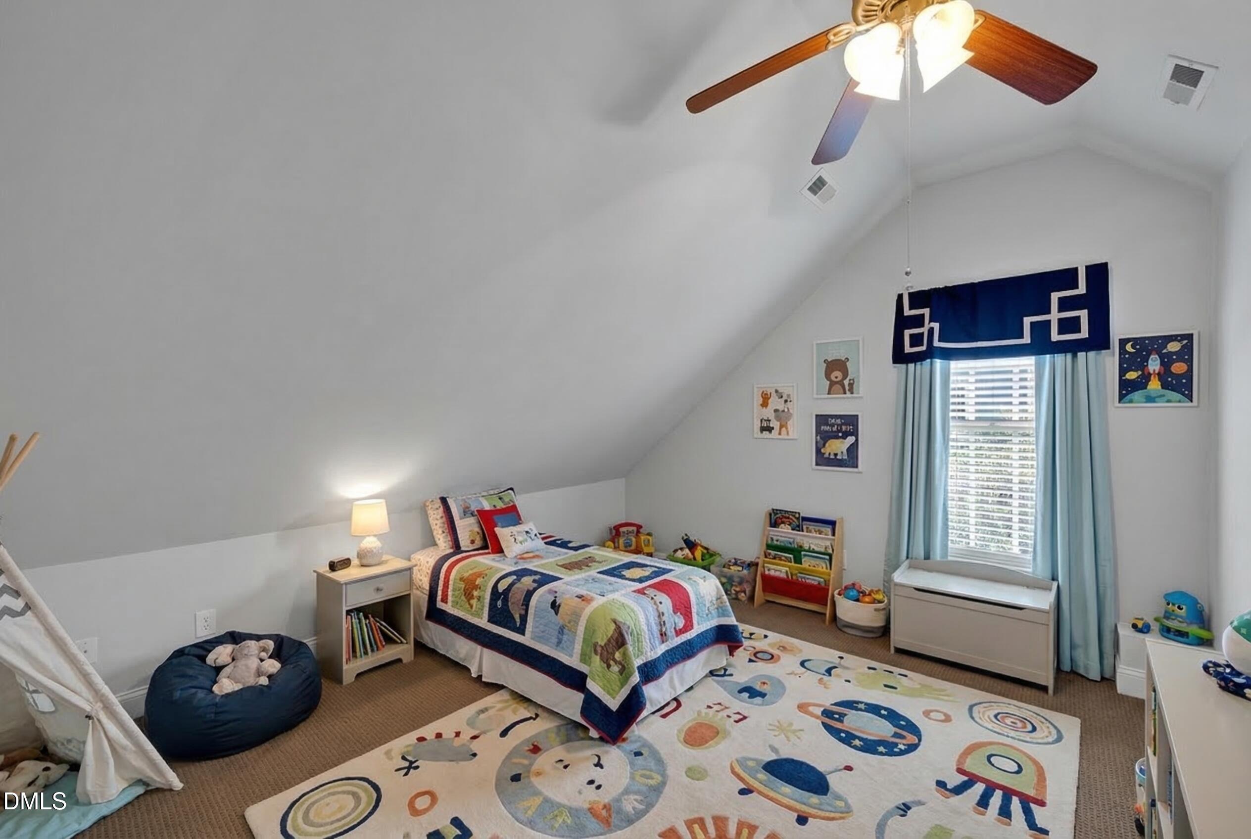 8005 Looking Glass Court Raleigh, NC 27612 - Photo 28 of 75 a bedroom with bed and a window