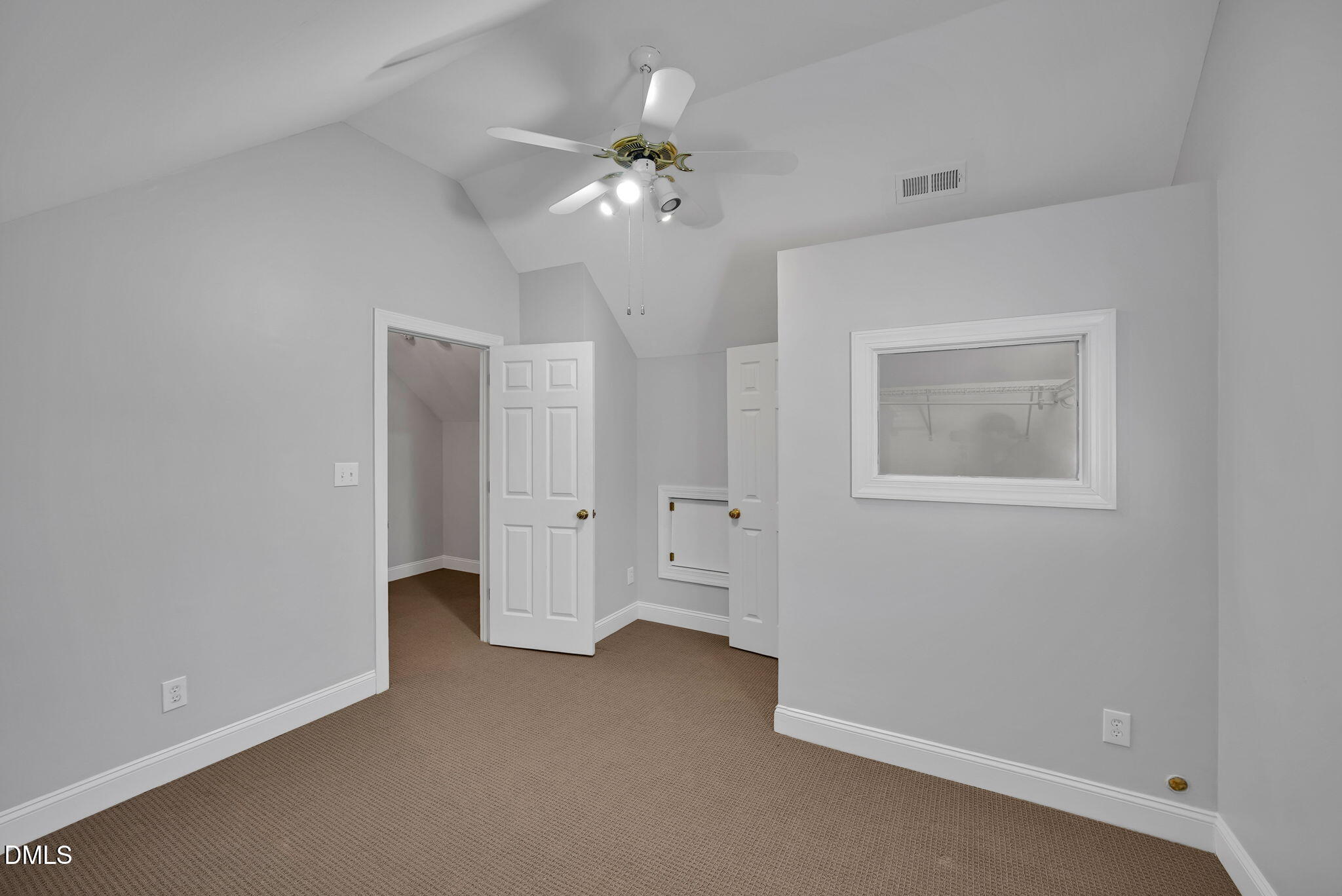 8005 Looking Glass Court Raleigh, NC 27612 - Photo 32 of 75 a view of an empty room with a window