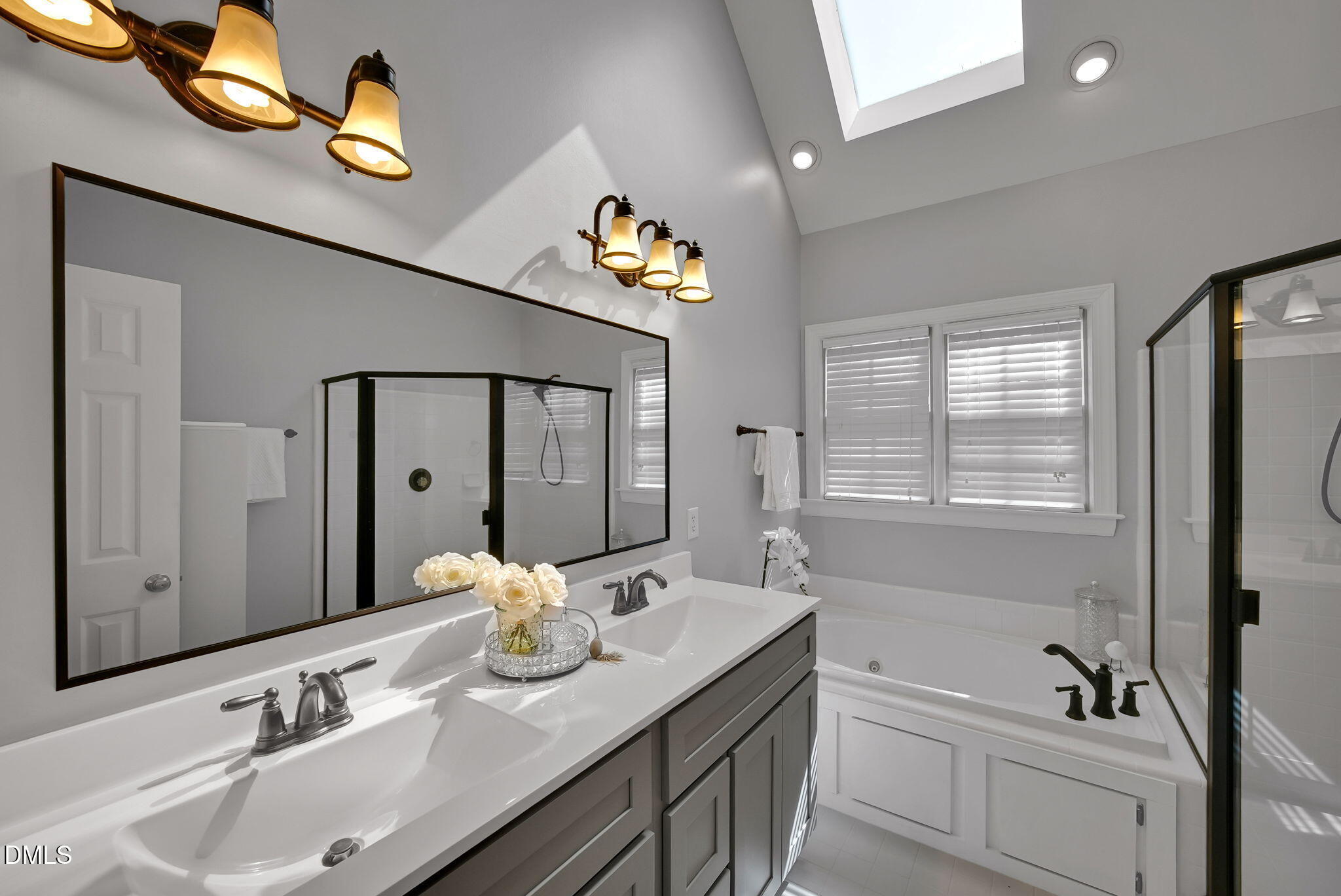 8005 Looking Glass Court Raleigh, NC 27612 - Photo 42 of 75 a bathroom with a sink double vanity granite tub and shower