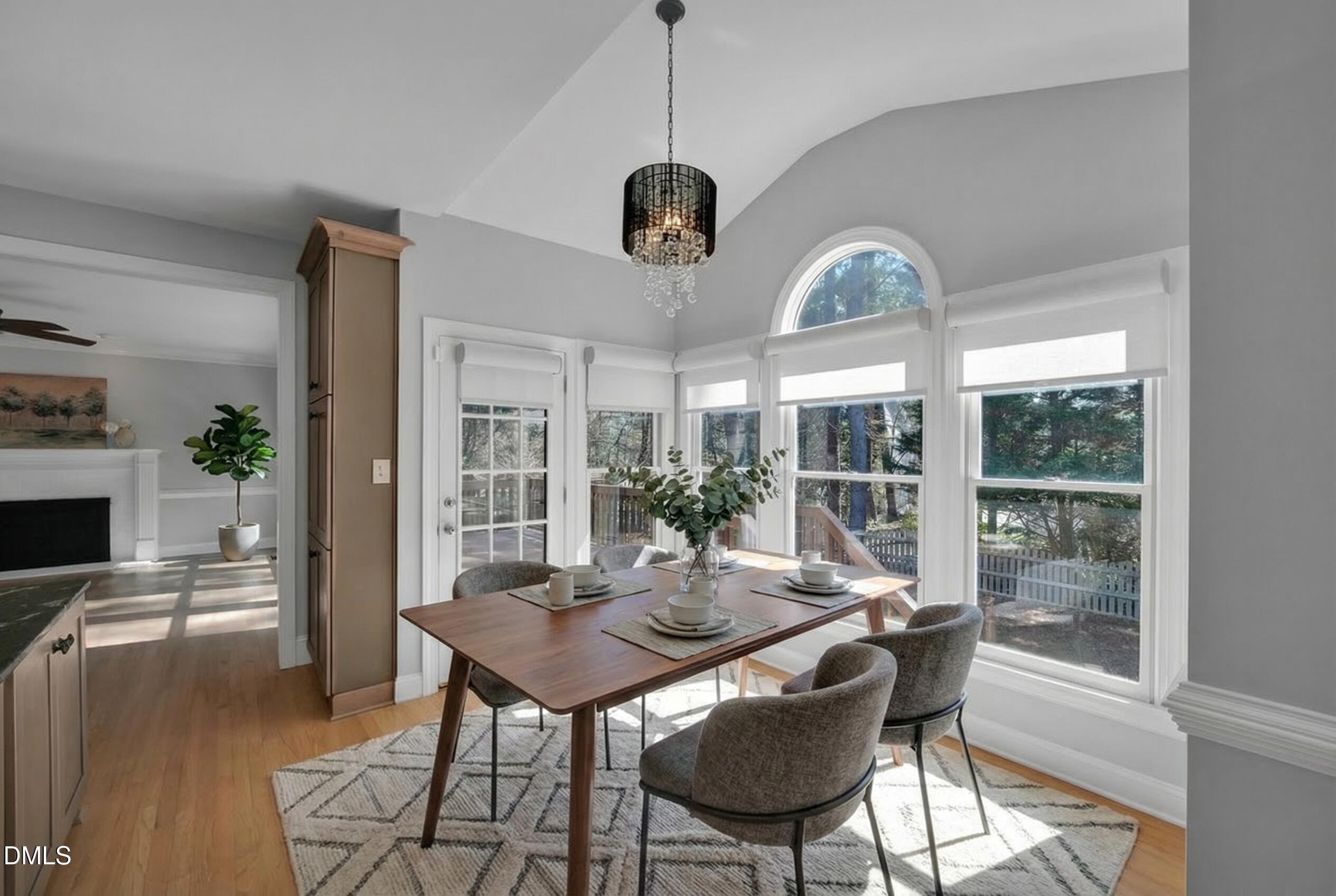 8005 Looking Glass Court Raleigh, NC 27612 - Photo 5 of 75 a view of a dining room with furniture window and wooden floor