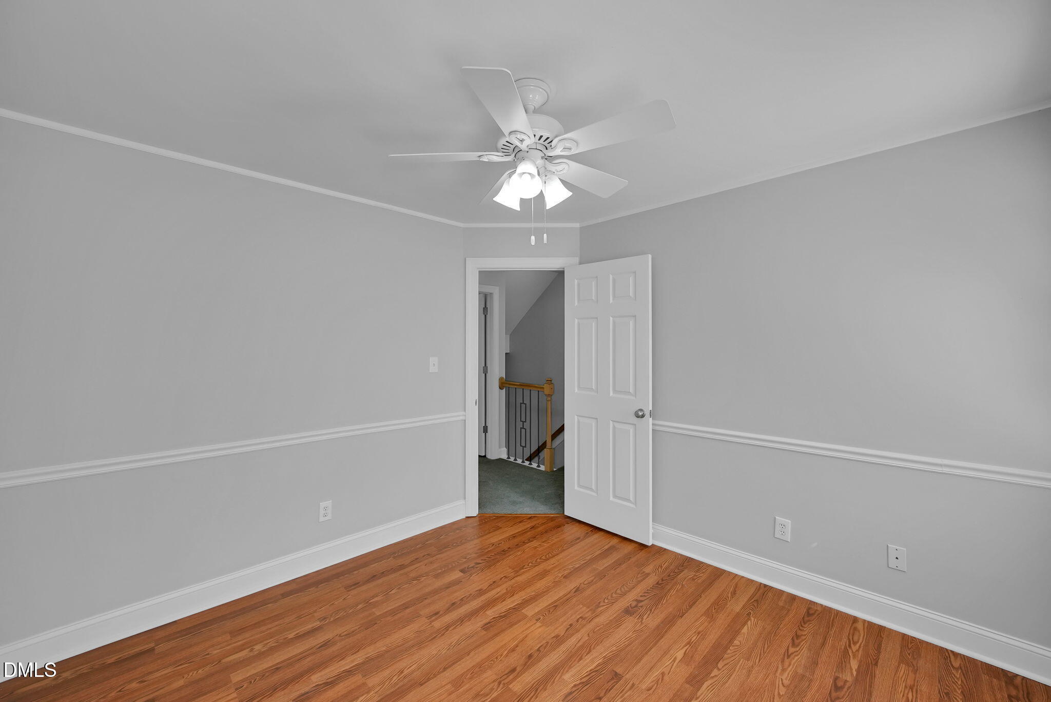 8005 Looking Glass Court Raleigh, NC 27612 - Photo 51 of 75 wooden floor in an empty room with a window