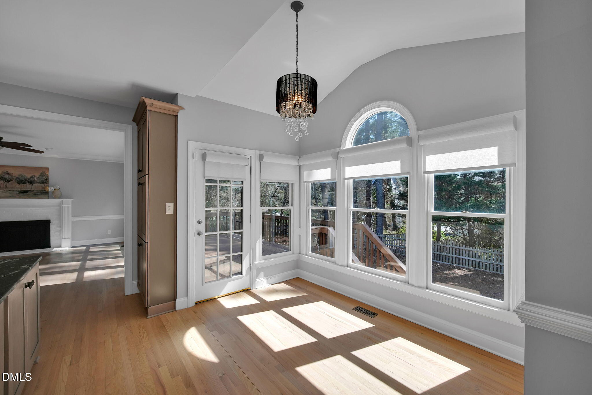 8005 Looking Glass Court Raleigh, NC 27612 - Photo 6 of 75 a view of a room with wooden floor fireplace and windows