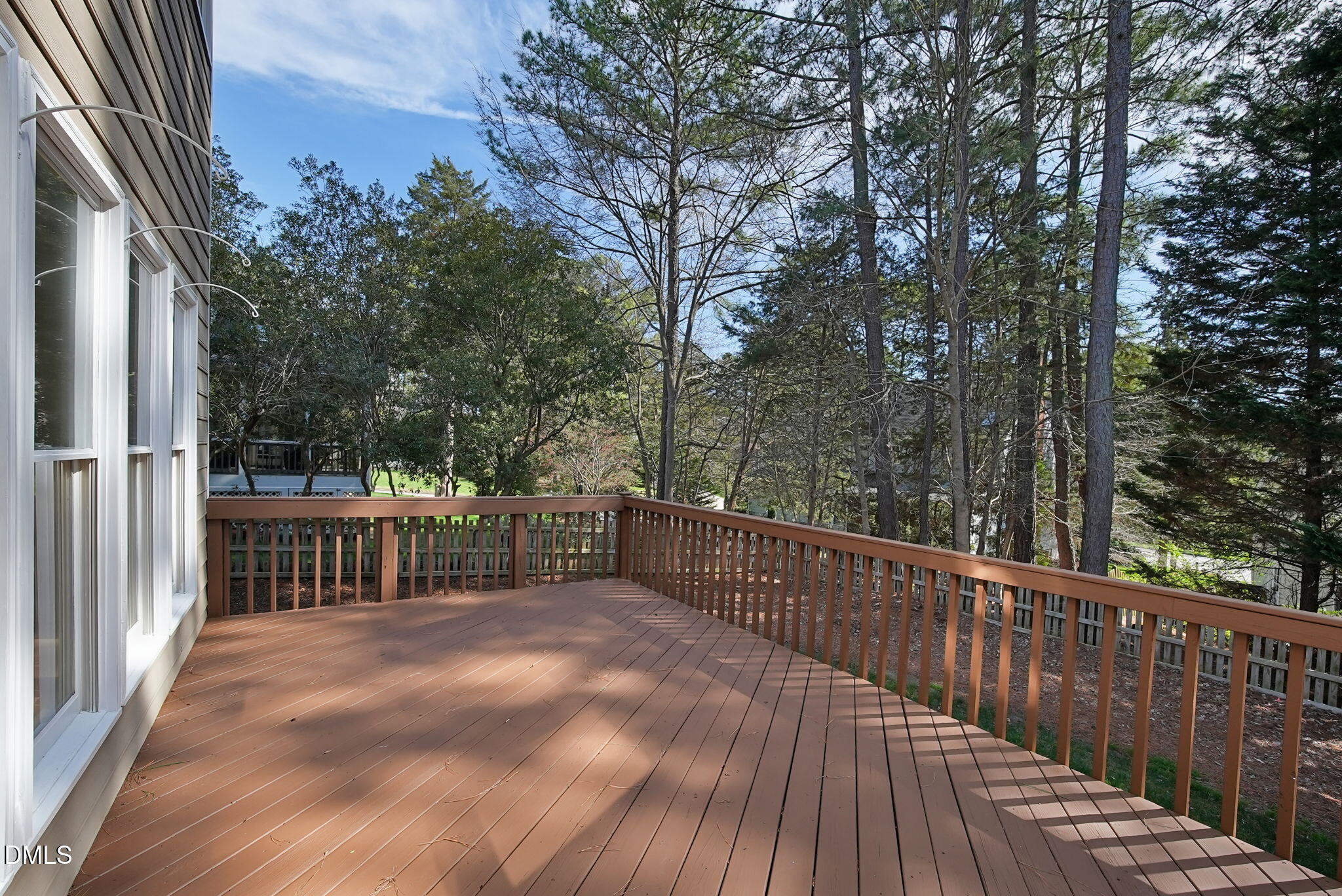 8005 Looking Glass Court Raleigh, NC 27612 - Photo 63 of 75 a view of a balcony with wooden floor and fence