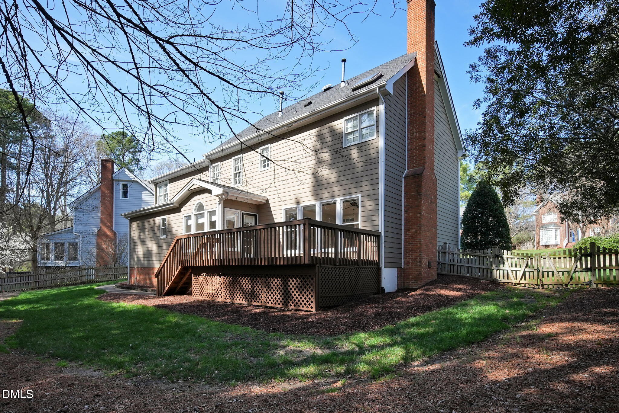 8005 Looking Glass Court Raleigh, NC 27612 - Photo 66 of 75 a view of a house with a large window and wooden fence