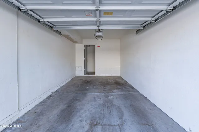 a view of a hallway with a ceiling fan
