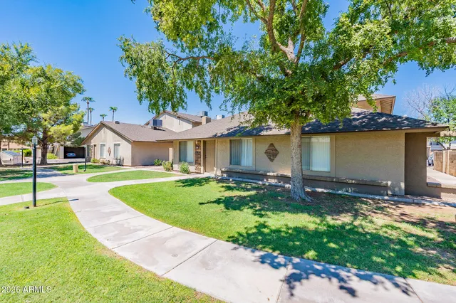 a front view of house with yard and outdoor seating