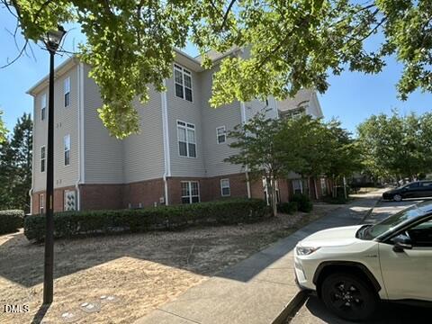 2510 Friedland Place, Unit 102 Raleigh, NC 27617 - Photo 41 of 42 a front view of a house with garden