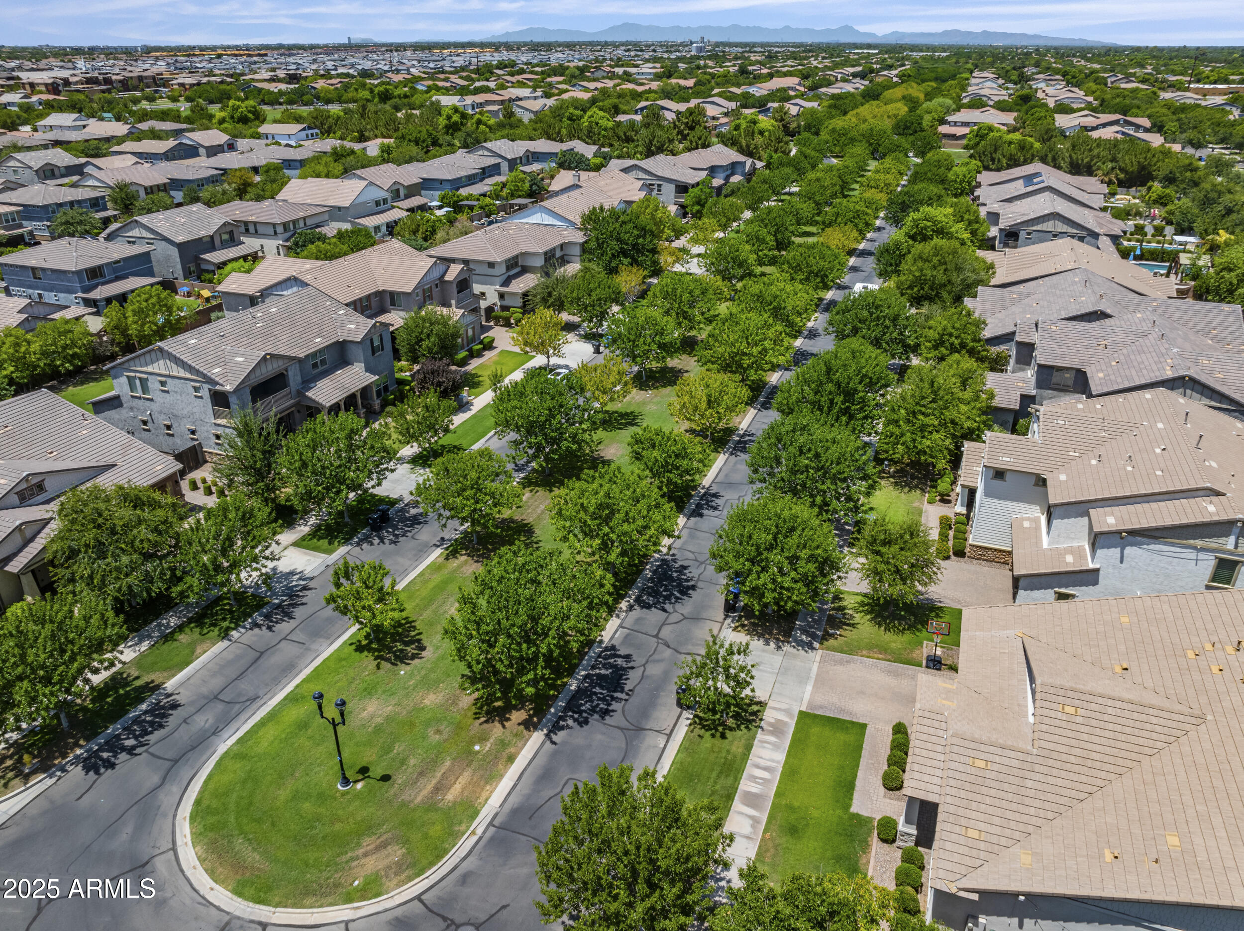 4292 East Morrison Ranch Parkway Gilbert, AZ 85296 - Photo 52 of 55 an aerial view of residential house with outdoor space and trees all around