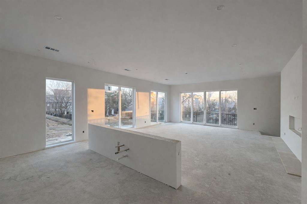 2247 Mail Avenue Dallas, TX 75235 - Photo 15 of 26 a large white room with windows and view of an empty room