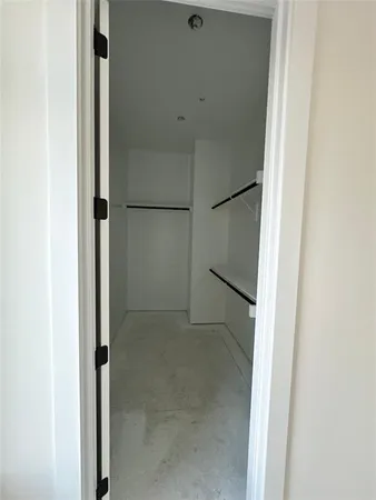 a view of an empty walk in closet