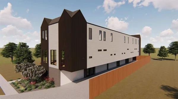 a front view of a building with garden