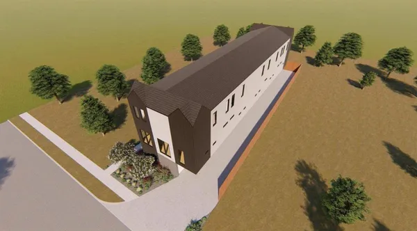 a kitchen with white cabinets and window