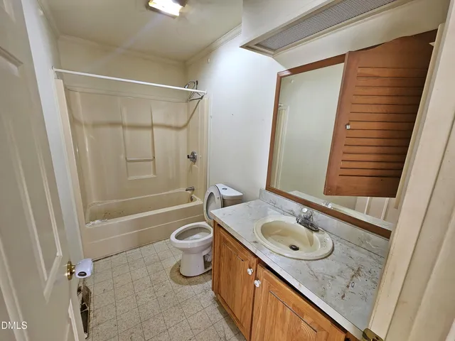 a kitchen with stainless steel appliances a refrigerator a stove a sink and a refrigerator