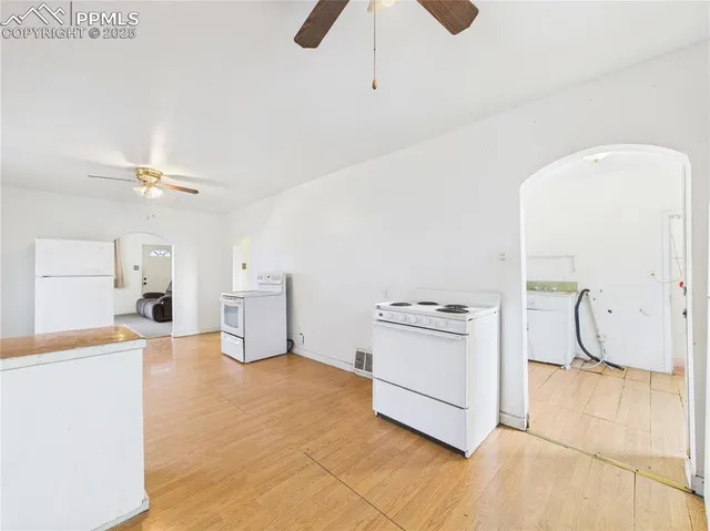 a kitchen with stainless steel appliances granite countertop a sink and cabinets