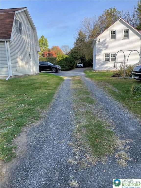 51 South Church Street Nazareth, PA 18064 - Photo 23 of 26 a view of a white house with a yard