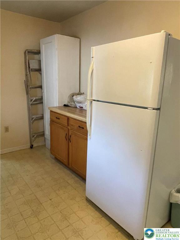 51 South Church Street Nazareth, PA 18064 - Photo 4 of 26 a white refrigerator freezer and a stove sitting inside of a kitchen