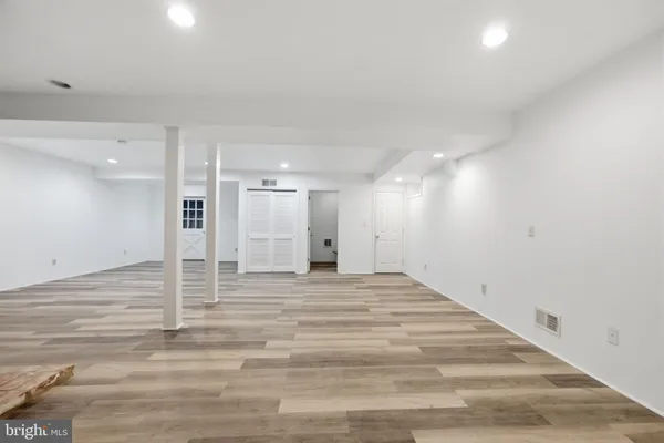 a picture of a bench in front of a window