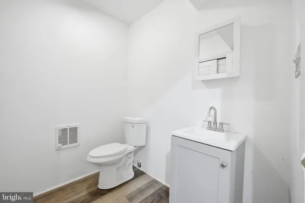 a picture of a very nice looking living room with a white refrigerator