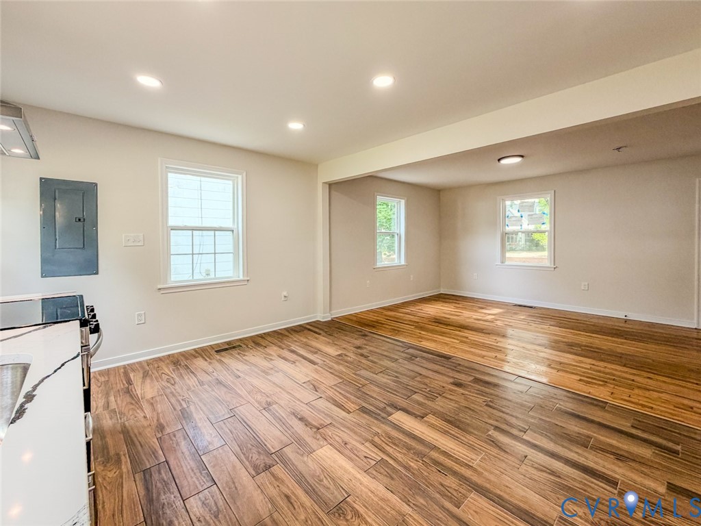 3409 Meadowbridge Road Richmond, VA 23222 - Photo 9 of 32 a view of empty room with wooden floor and fan