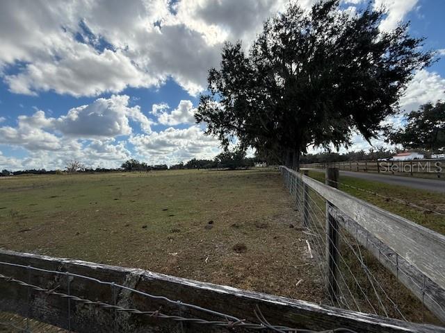 2181 East Trapnell Road Plant City, FL 33566 - Photo 5 of 7 a view of a lake next to a yard