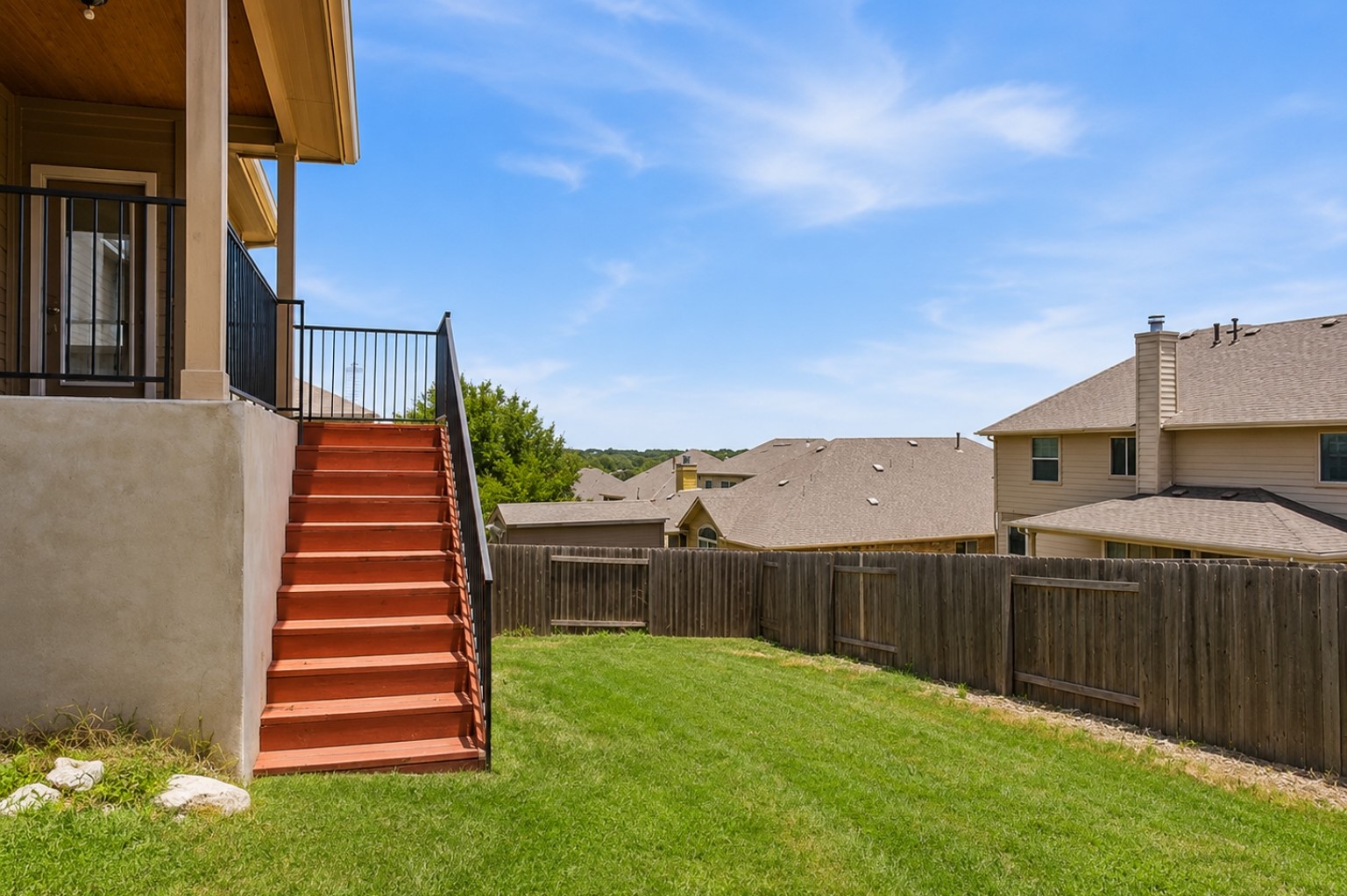 304 Santa Maria Street Georgetown, TX 78628 - Photo 34 of 37 A tiered outdoor living space descends to a private fenced yard, perfect for relaxation or play. irtually Enhanced
