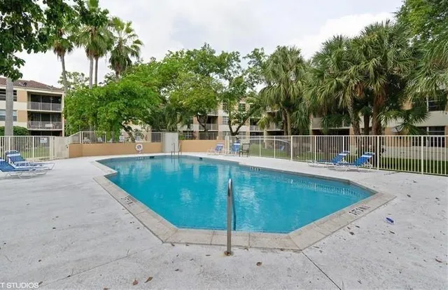 a view of a swimming pool with a backyard