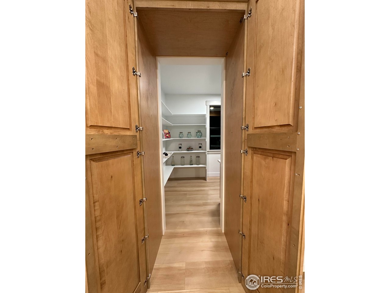 15276 Ypsilon Circle Mead, CO 80542 - Photo 14 of 40 a view of a hallway with wooden floor