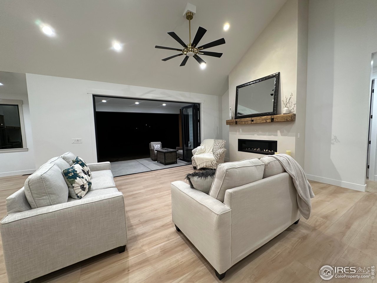 15276 Ypsilon Circle Mead, CO 80542 - Photo 17 of 40 a living room with furniture and a fireplace