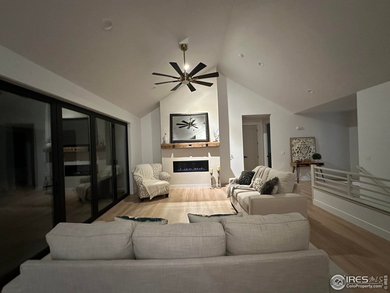 15276 Ypsilon Circle Mead, CO 80542 - Photo 19 of 40 a living room with furniture and a ceiling fan