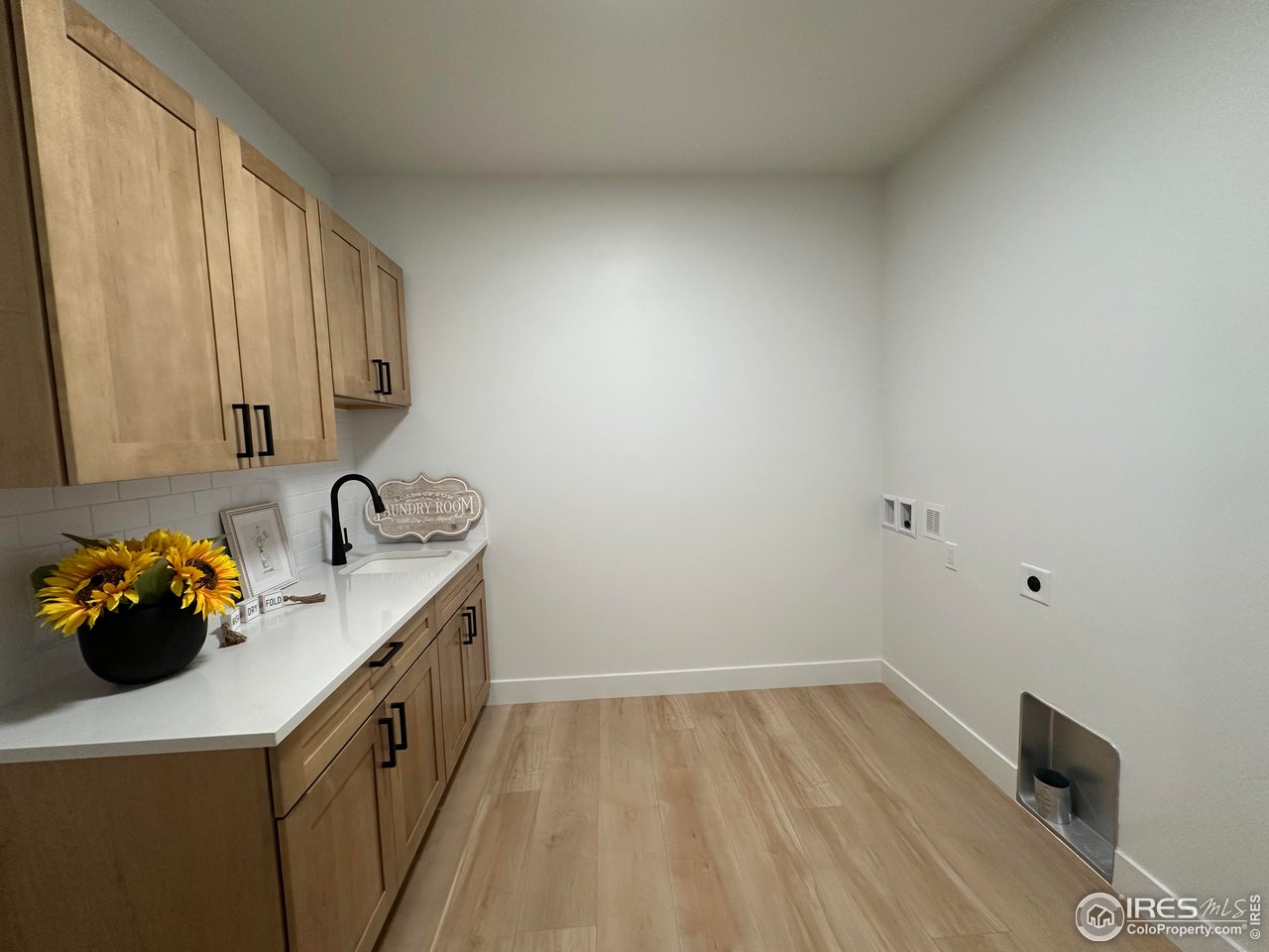 15276 Ypsilon Circle Mead, CO 80542 - Photo 33 of 40 a kitchen with a sink and cabinets