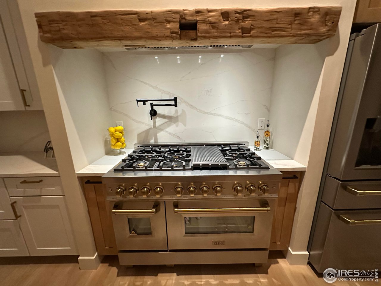 15276 Ypsilon Circle Mead, CO 80542 - Photo 10 of 40 a stove top oven sitting inside of a kitchen