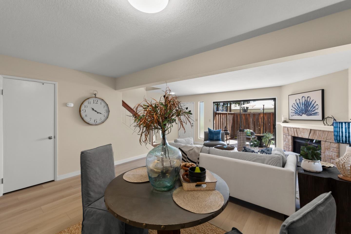 754 Gettysburg Way Gilroy, CA 95020 - Photo 13 of 56 a living room with furniture a fireplace and wall paintings