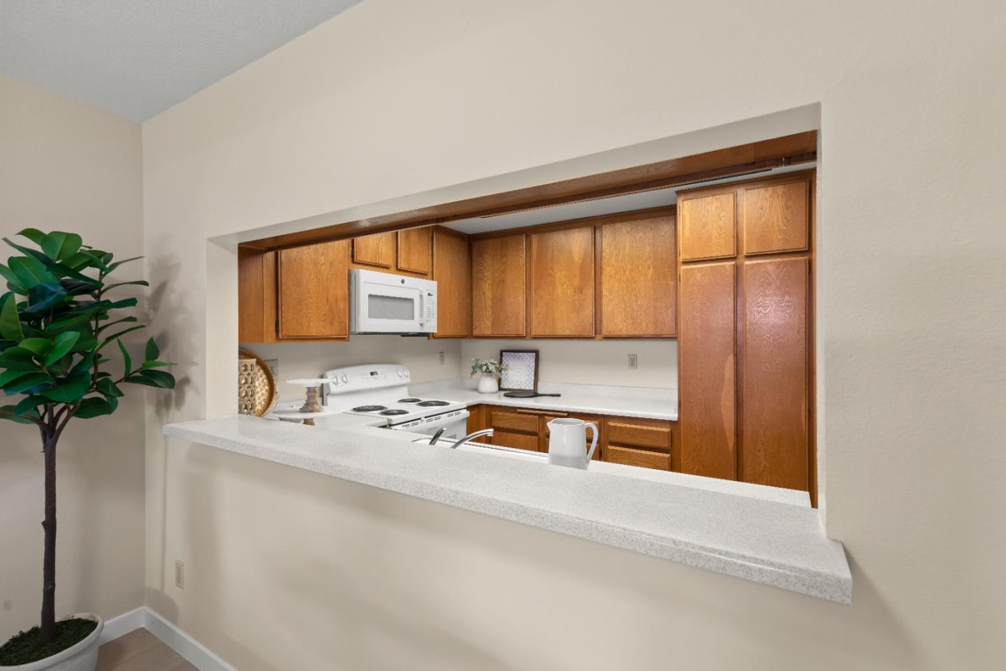754 Gettysburg Way Gilroy, CA 95020 - Photo 14 of 56 a kitchen with a refrigerator a sink and a window
