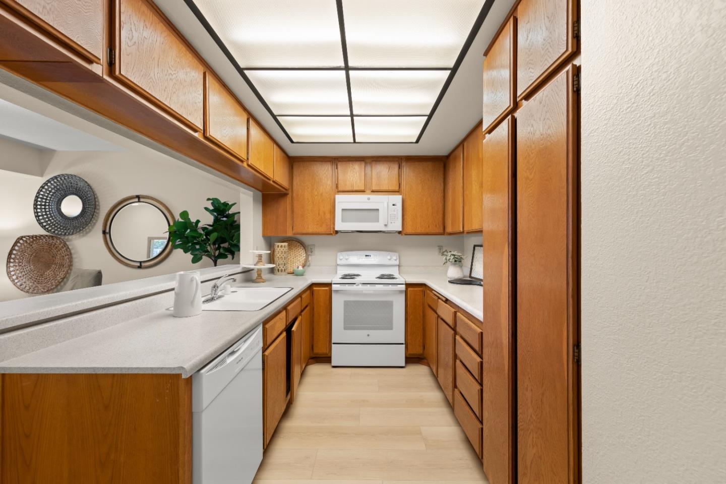 754 Gettysburg Way Gilroy, CA 95020 - Photo 15 of 56 a kitchen with stainless steel appliances granite countertop a sink a stove and a refrigerator