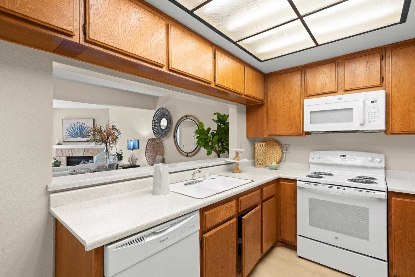 754 Gettysburg Way Gilroy, CA 95020 - Photo 16 of 56 a kitchen with a stove cabinets and a sink