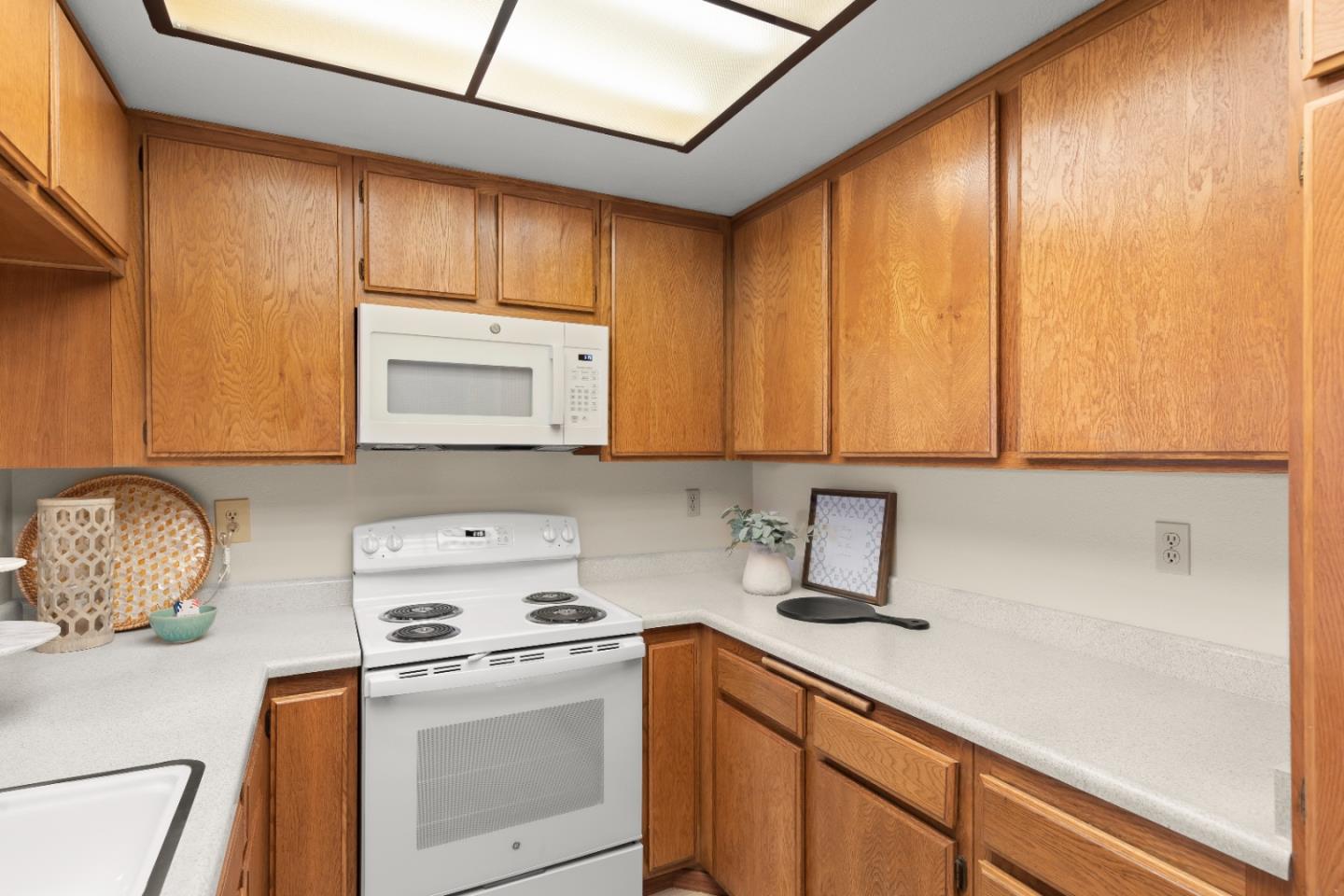 754 Gettysburg Way Gilroy, CA 95020 - Photo 17 of 56 a kitchen with a sink cabinets and appliances