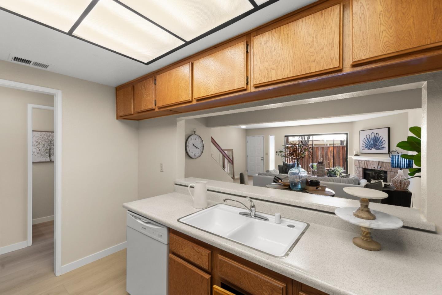 754 Gettysburg Way Gilroy, CA 95020 - Photo 18 of 56 a kitchen with a sink and a stove top oven