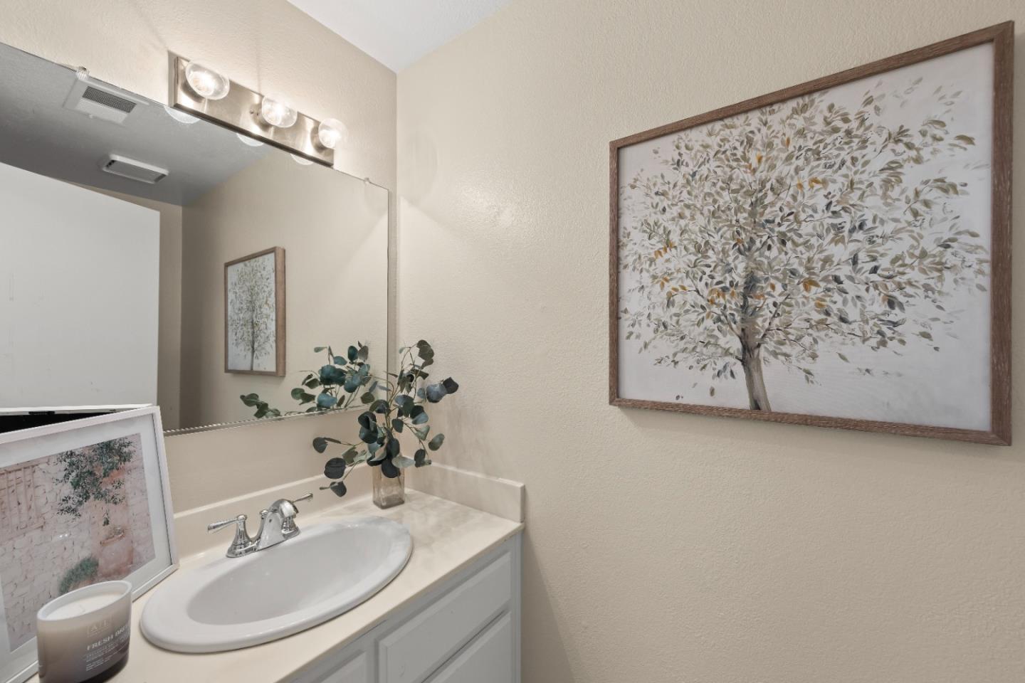 754 Gettysburg Way Gilroy, CA 95020 - Photo 20 of 56 a bathroom with a sink vanity mirror and toilet