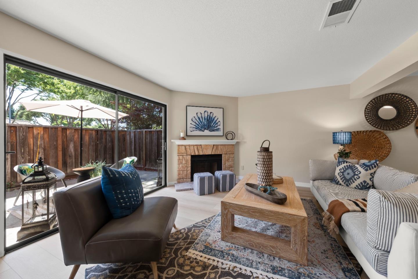 754 Gettysburg Way Gilroy, CA 95020 - Photo 7 of 56 a living room with furniture and a fireplace