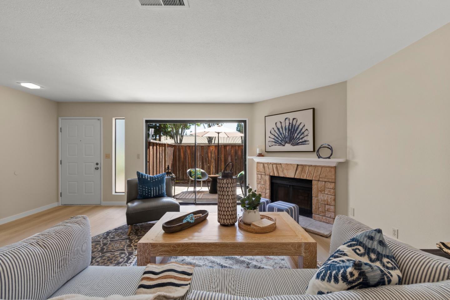 754 Gettysburg Way Gilroy, CA 95020 - Photo 9 of 56 a living room with furniture and a fireplace