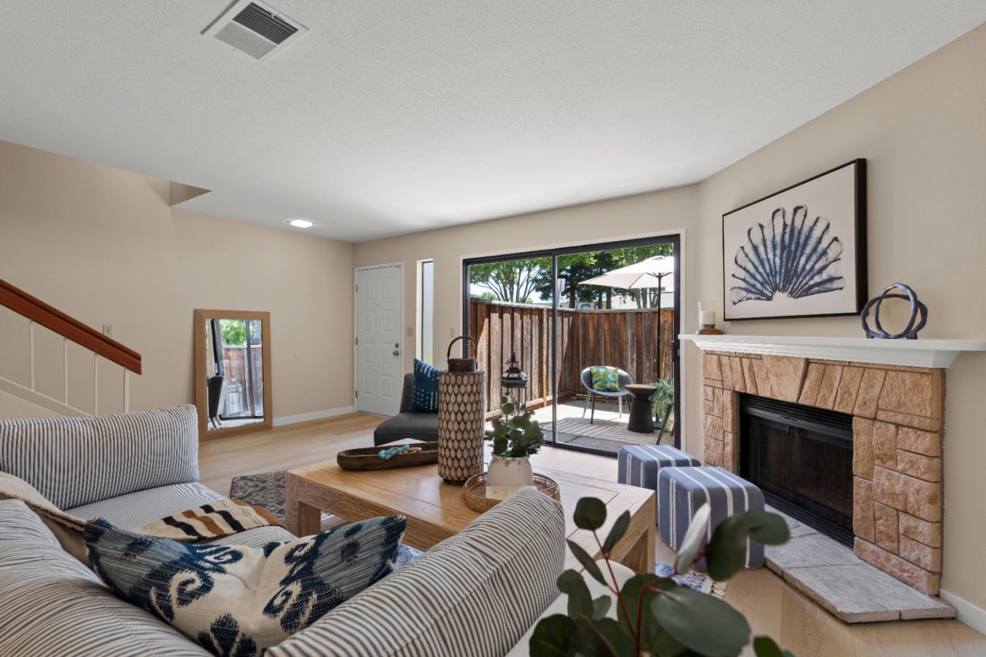 754 Gettysburg Way Gilroy, CA 95020 - Photo 10 of 56 a living room with furniture and a fireplace