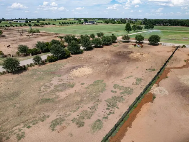 a view of a lake with a yard and lake