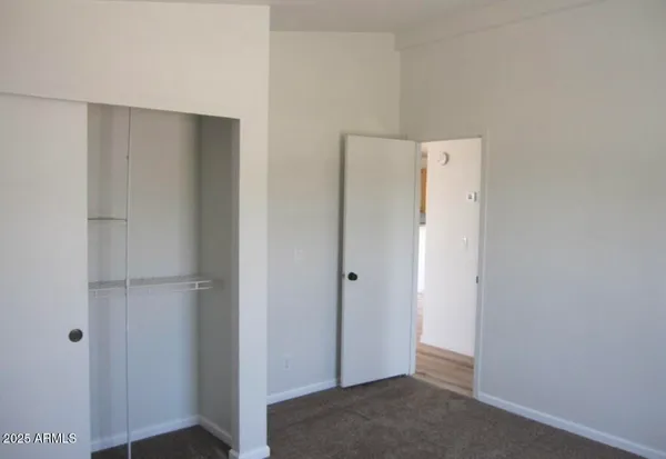 a view of a house with a snow in the background
