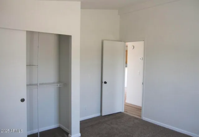 a view of a house with a snow in the background