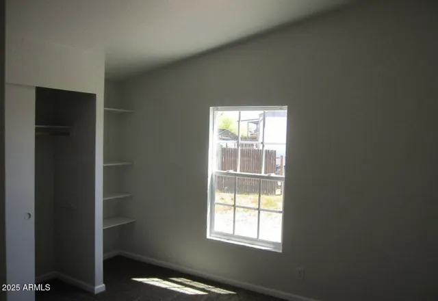 an empty room with windows