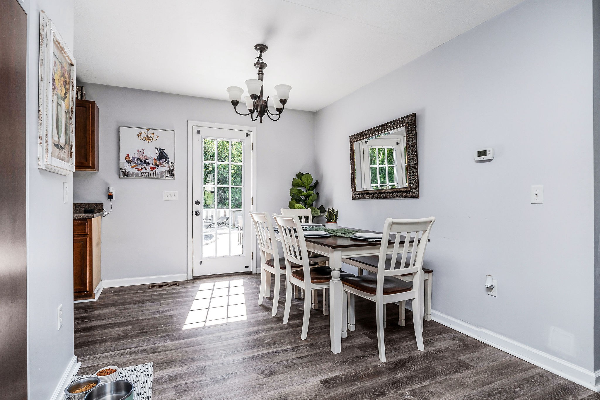 6215 Cheyenne Trail Baxter, TN 38544 - Photo 13 of 27 a view of a dining room with furniture wooden floor and chandelier
