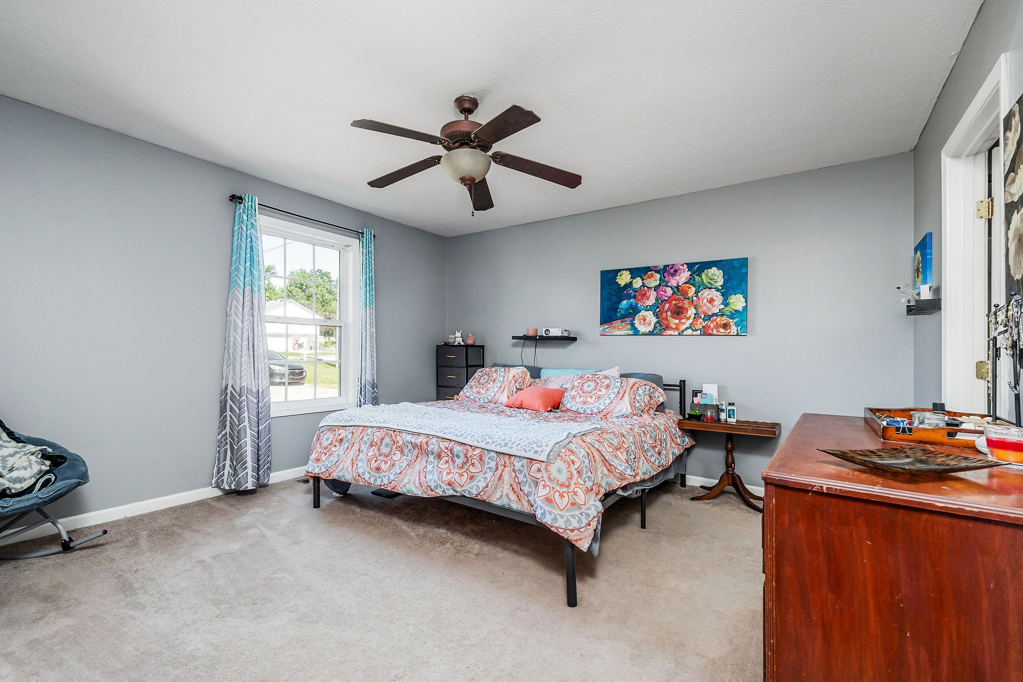 6215 Cheyenne Trail Baxter, TN 38544 - Photo 15 of 27 a bedroom with a bed and a chandelier