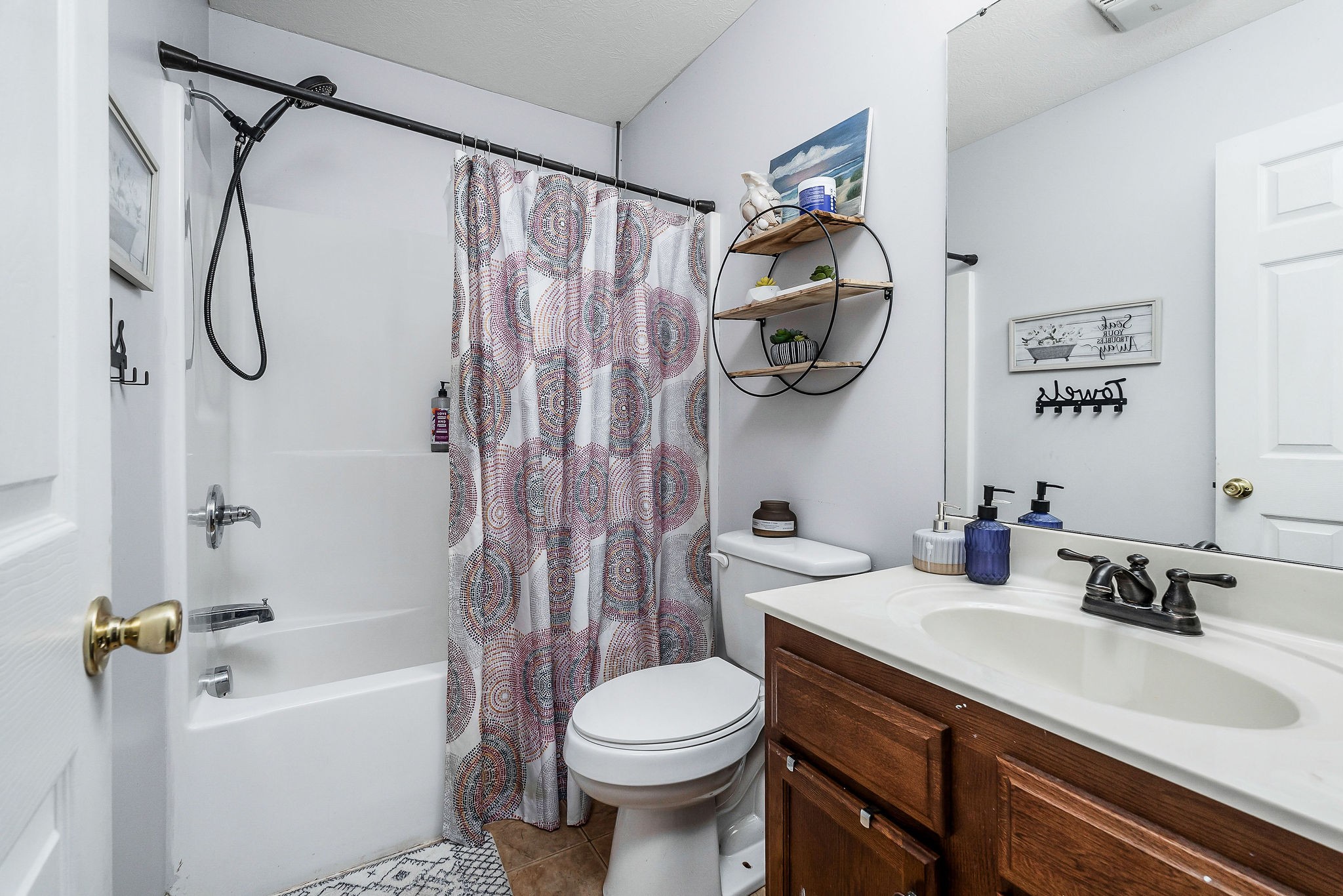 6215 Cheyenne Trail Baxter, TN 38544 - Photo 22 of 27 a bathroom with a sink a toilet and a bathtub